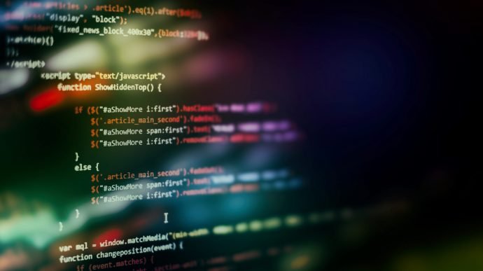 CSS, JavaScript and HTML usage. Monitor closeup of function source code. Abstract IT technology background. Software source code. Website HTML Code on the Laptop Display Closeup Photo. Desktop PC monitor photo.