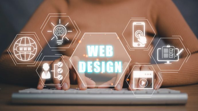 Web design concept, Person typing on keyboard with web design icon on virtual screen.